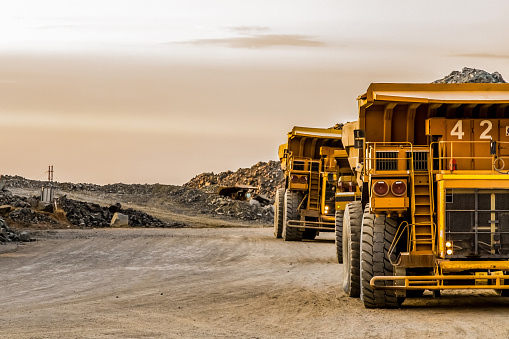 large-mining-rock-dump-trucks-transporting-platinum-ore-for-processing