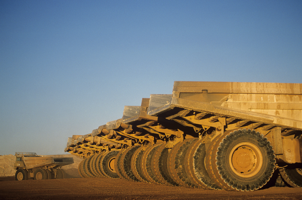 ore-hauling-trucks-in-row-telfer-western-australia